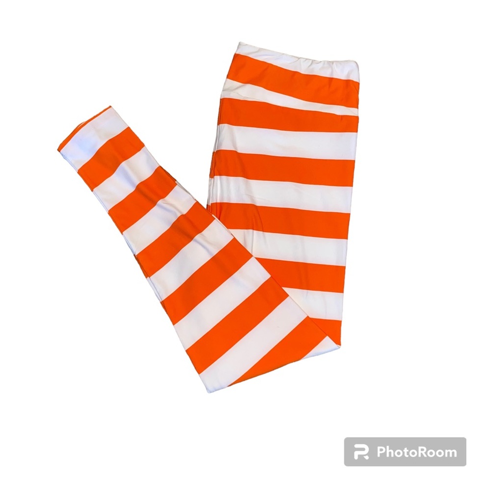 LuLaRoe orange and white striped leggings in women’s size TC (12-18)